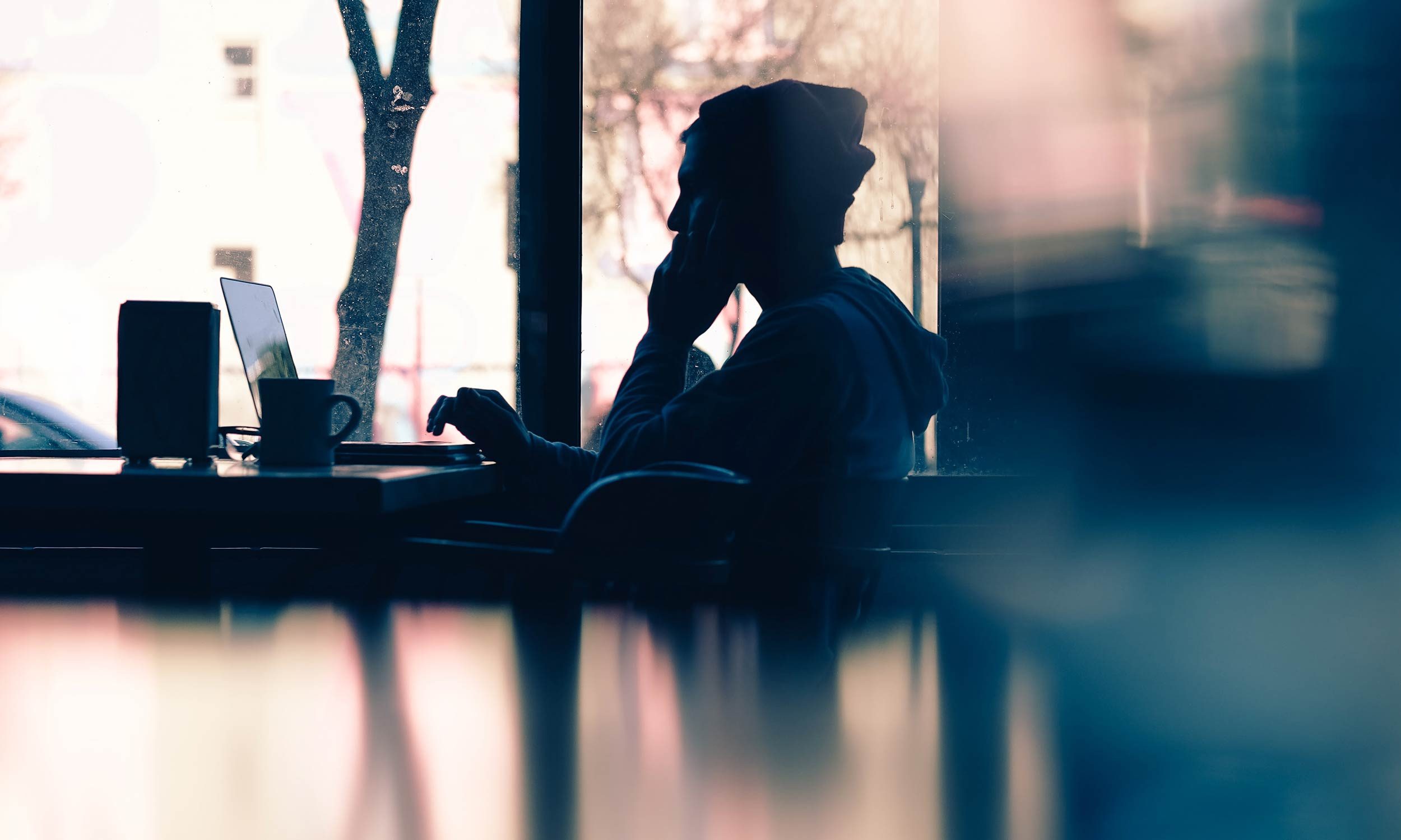 man reading laptop